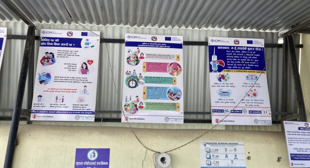 Three health information posters on a wall