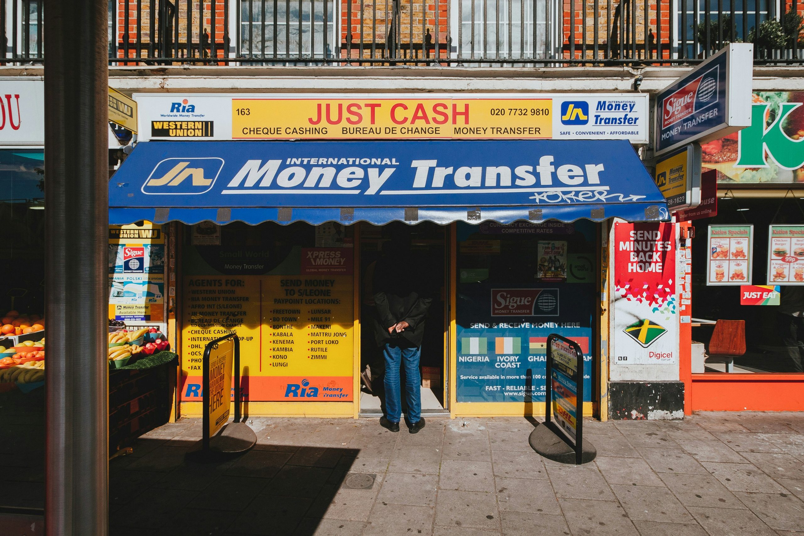 A brightly coloured money transfer shop on a high street